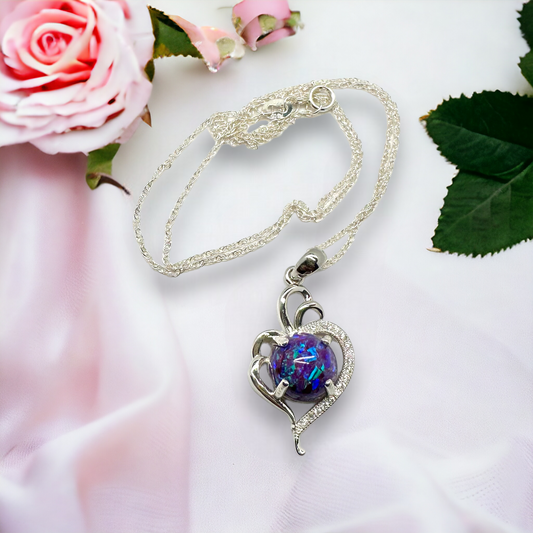 Detailed view of the Radiant Heart pendant in sterling silver, showcasing a sparkly purple crushed opal stone, displayed with the full silver chain, reflecting the beauty of cherished memories.