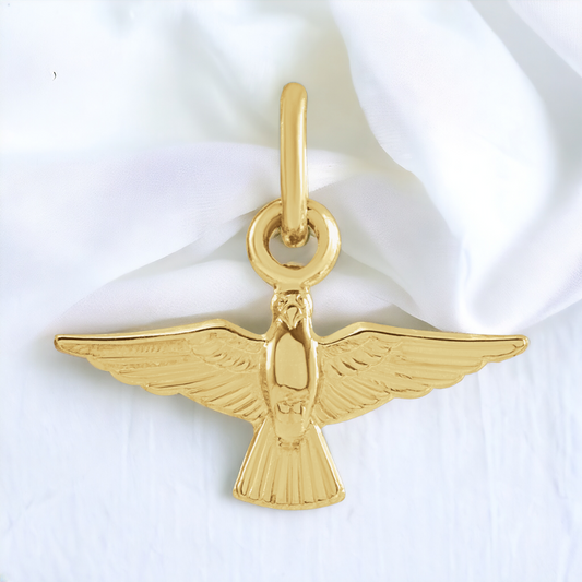 14K yellow gold dove pendant showcasing detailed wings and a polished finish, radiating peace and elegance.
