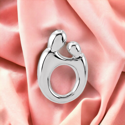 14K White Gold Mother and Child Silhouette Slide Pendant  on pink fabric. 