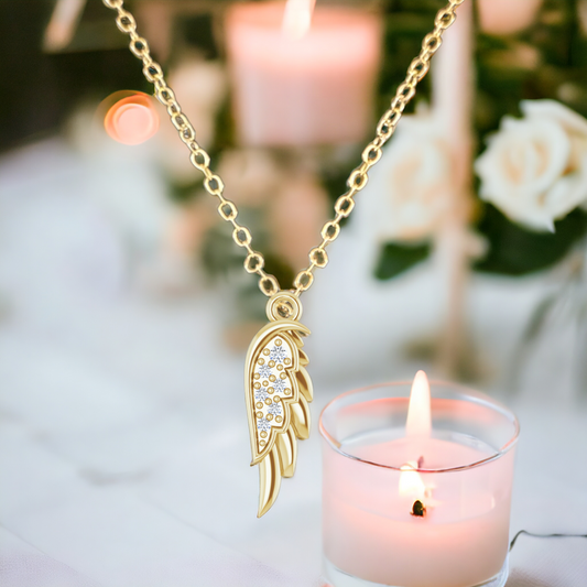 14K yellow gold angel wing pendant on optional gold chain.