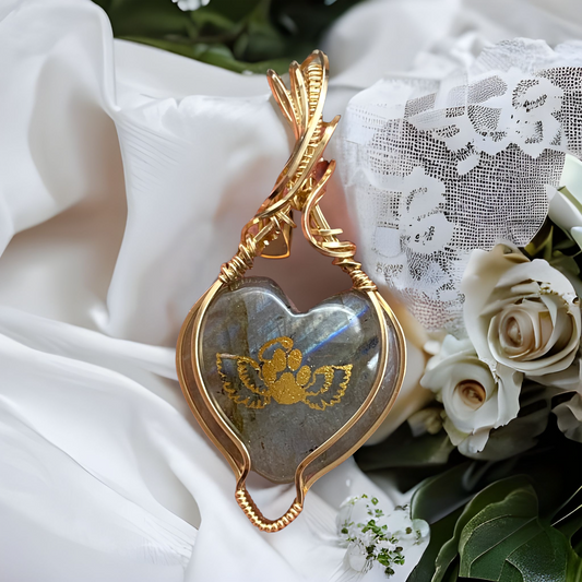 Labradorite heart-shaped gemstone with mesmerizing blue flashes set in a 14K Gold-Filled setting, featuring a gold angel wing paw-print design on the front - a touching necklace for anyone who has lost their beloved pet.