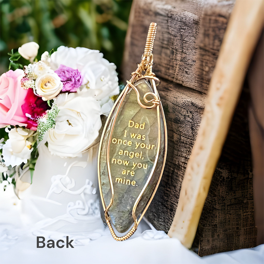 Gold quote on the back reads, "Dad I was once your angel, now you are mine." Labradorite marquise shaped natural gemstone with flashes of blue and green, set in 14K Gold-Filled with gold angel wing design on the front.