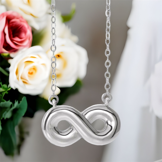 Sterling Silver  infinity inspired cremation ash necklace.