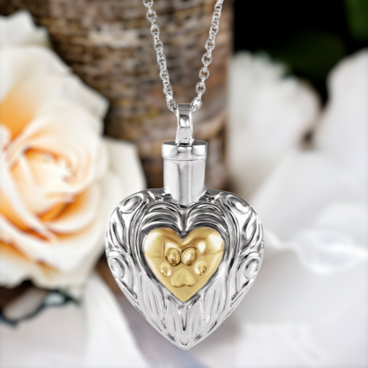 This pet cremation ash necklace for women is the perfect keepsake to remember a beloved pet, such as a cat or dog. Made of Sterling Silver with 14K Gold plated center heart.  